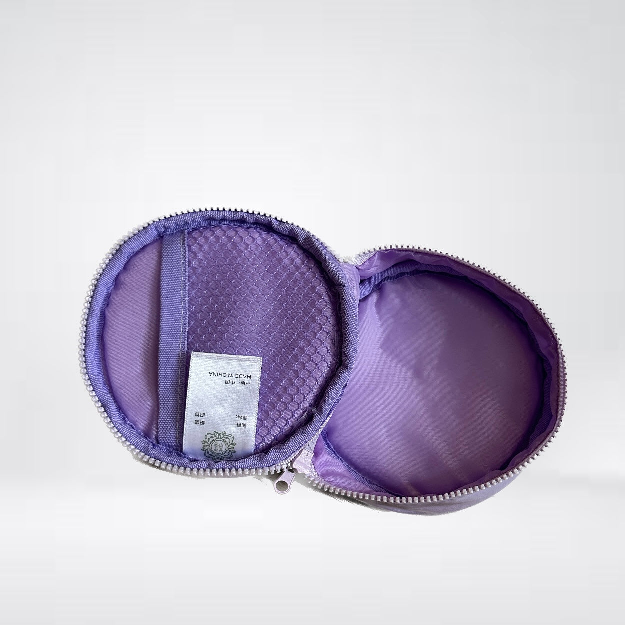 Tasche "Cases" in flieder mit Smiley-Stickerei für Kabel